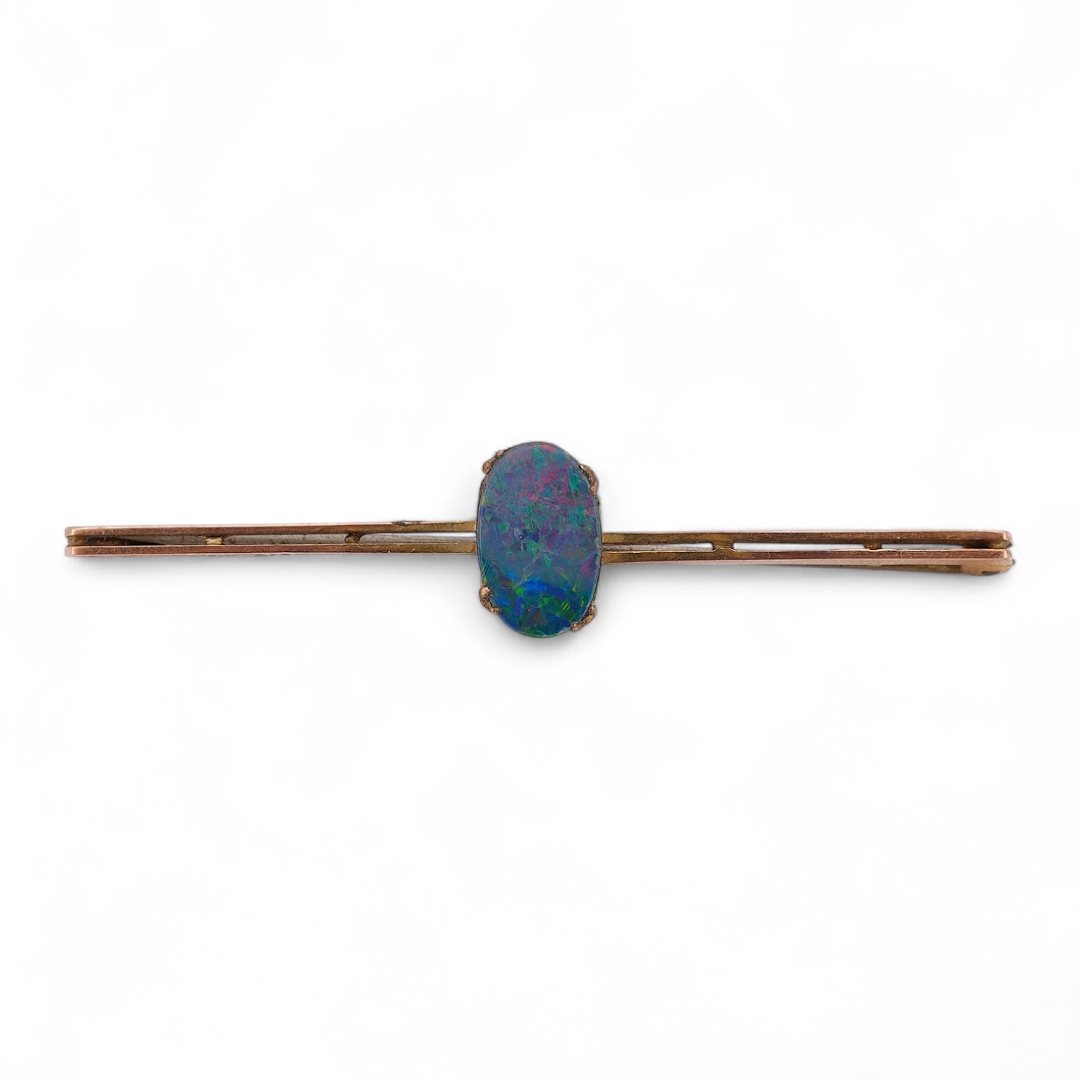 An early 20th century 9ct and single stone oval black opal doublet set bar brooch, 57mm, gross weight 2.3 grams, in an Asprey box. Condition - fair